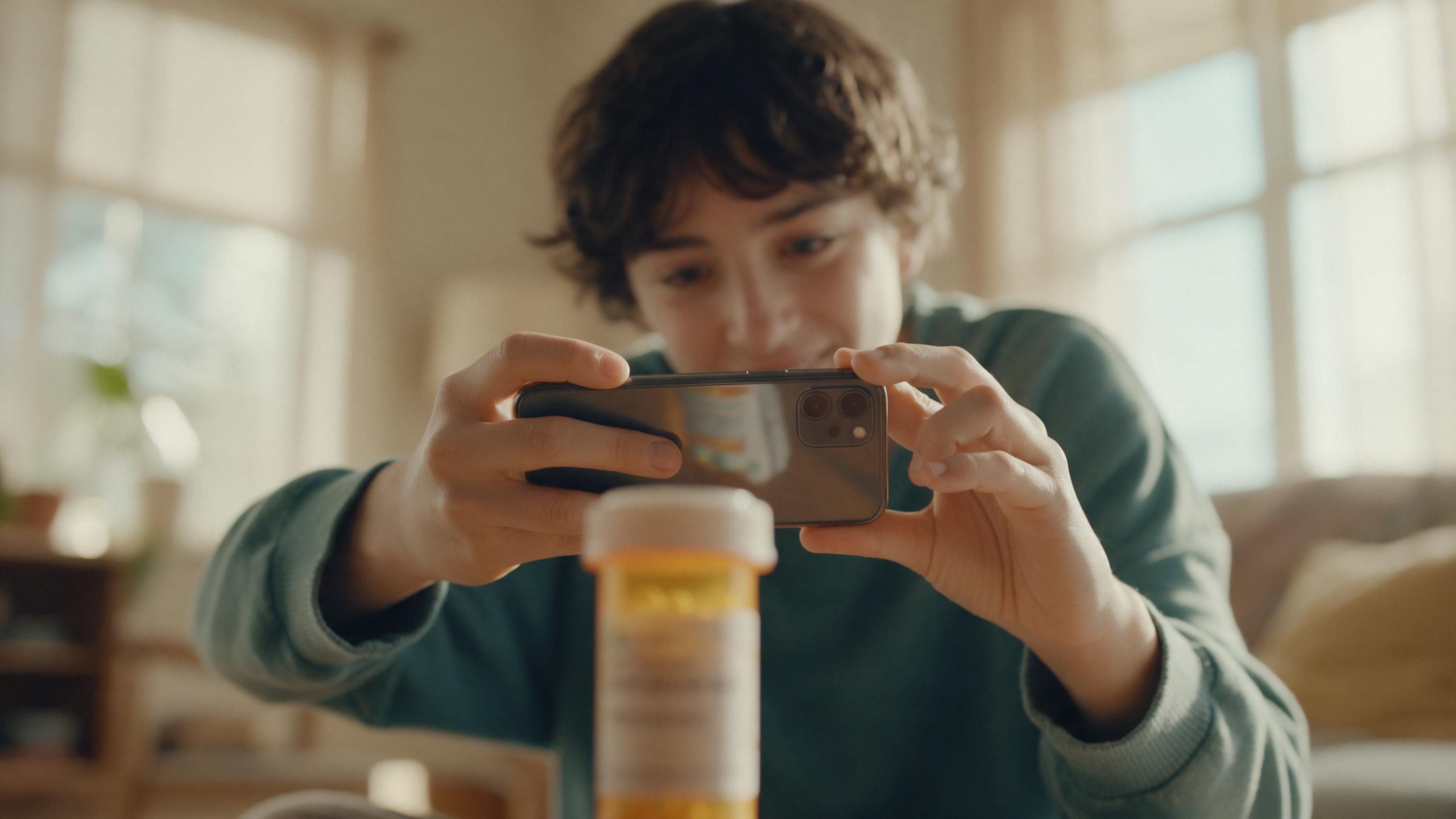 A phone camera reading the label on a prescription bottle.